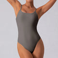 Slim triangle yoga jumpsuit for women, sleeveless tight fit, moisture-wicking, gray colour on model