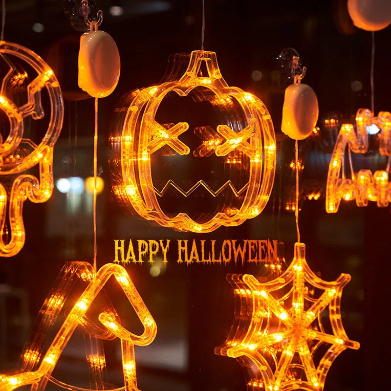 Halloween window hanging LED lights set with spider and pumpkin designs using suction cup installation