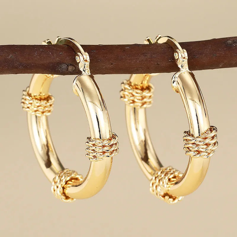 Geometric copper ear clips with linear and ring design in golden colour