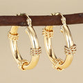 Geometric copper ear clips with linear and ring design in golden colour