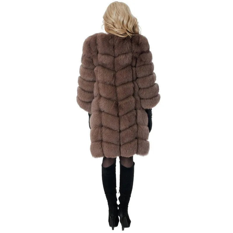Women's long black artificial fur coat with regular sleeves, shown on a model.