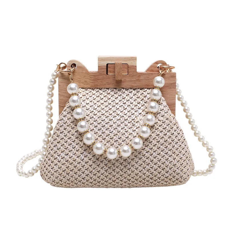 Women's straw woven shoulder bag with beach pearl chain detailing and horizontal square shape