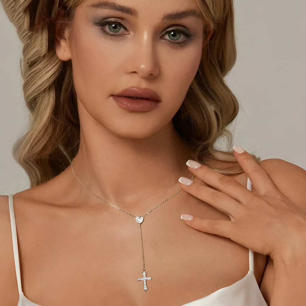 Simple sterling silver cross necklace with V-neck pendant on an O-ring chain.