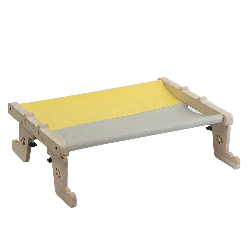 Wooden cat hanging bed hammock in a style style, mounted on a balcony railing for a cat to rest on.