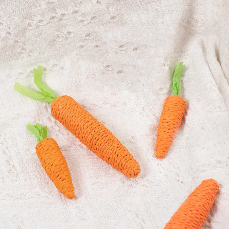 Cat toy set with carrot-shaped chew toys, crinkly paper toys, ringing stones, interactive sticks, and tooth grinding items