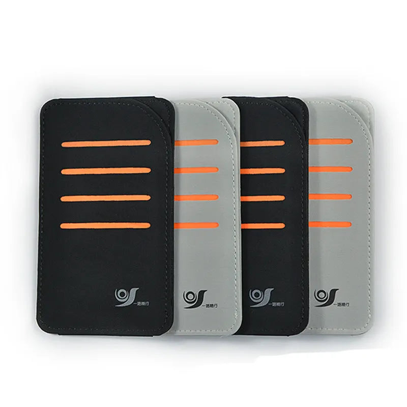 Set of four grey car sun visor panels next to a fabric storage pouch on a car dashboard.