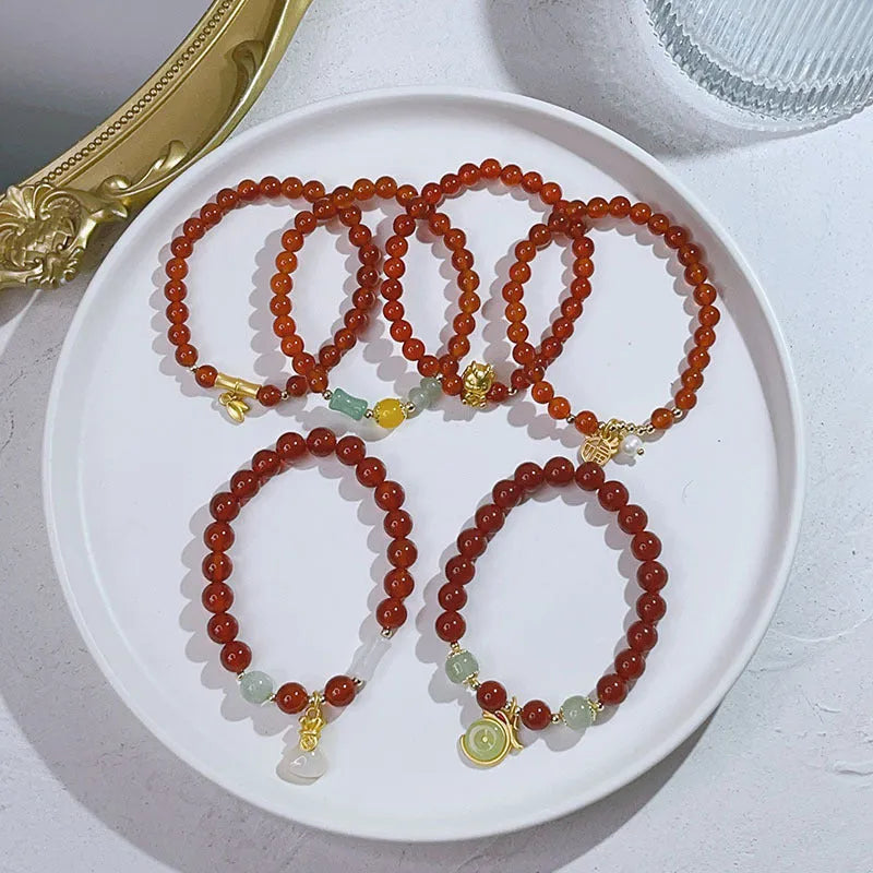 Red agate bracelet for women with Chinese style dragon motif, handmade from natural stone