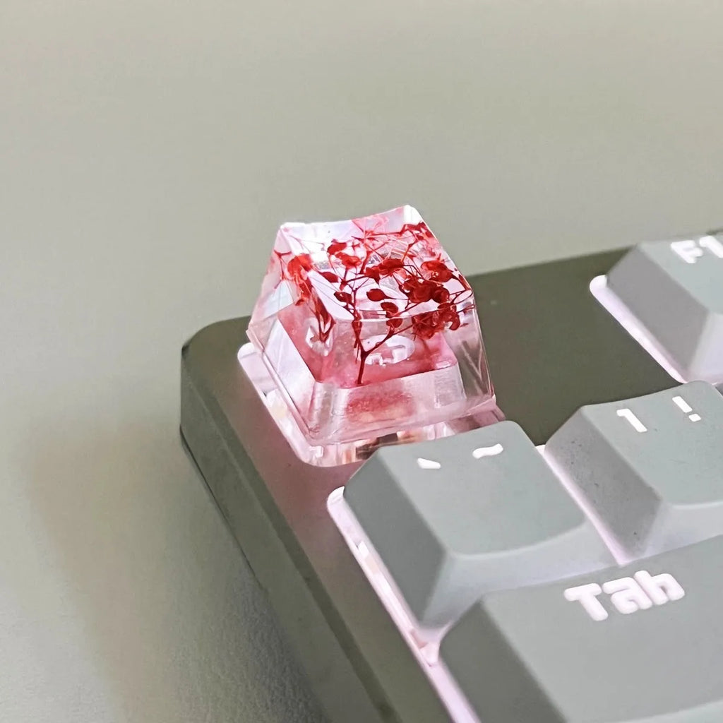 Transparent resin mechanical keyboard keycap showing starry sky galaxy design in multiple colour options