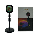 Rechargeable sunset projection lamp with USB cable showing rainbow and red light effect.
