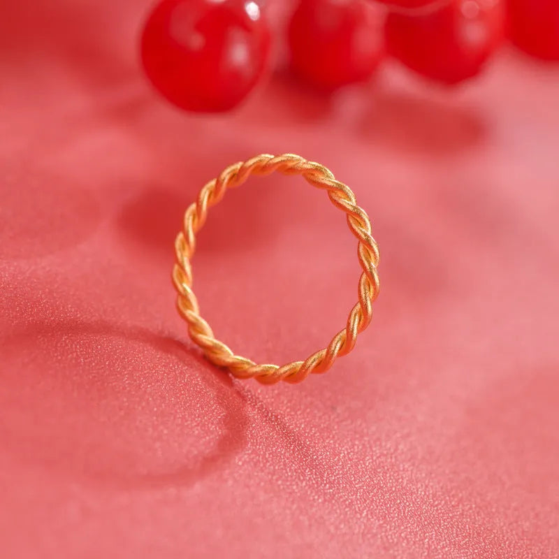 Simple bracelet brass gold plated ring in glossy finish on white background