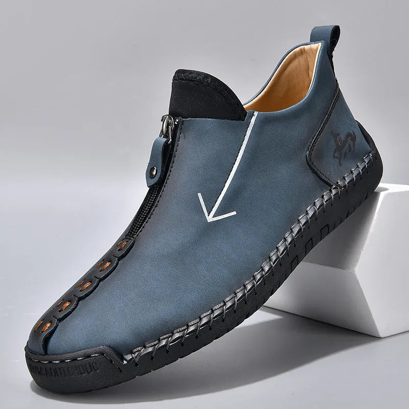 Men's black leather boots with front zipper and hand-stitched detailing on round toe