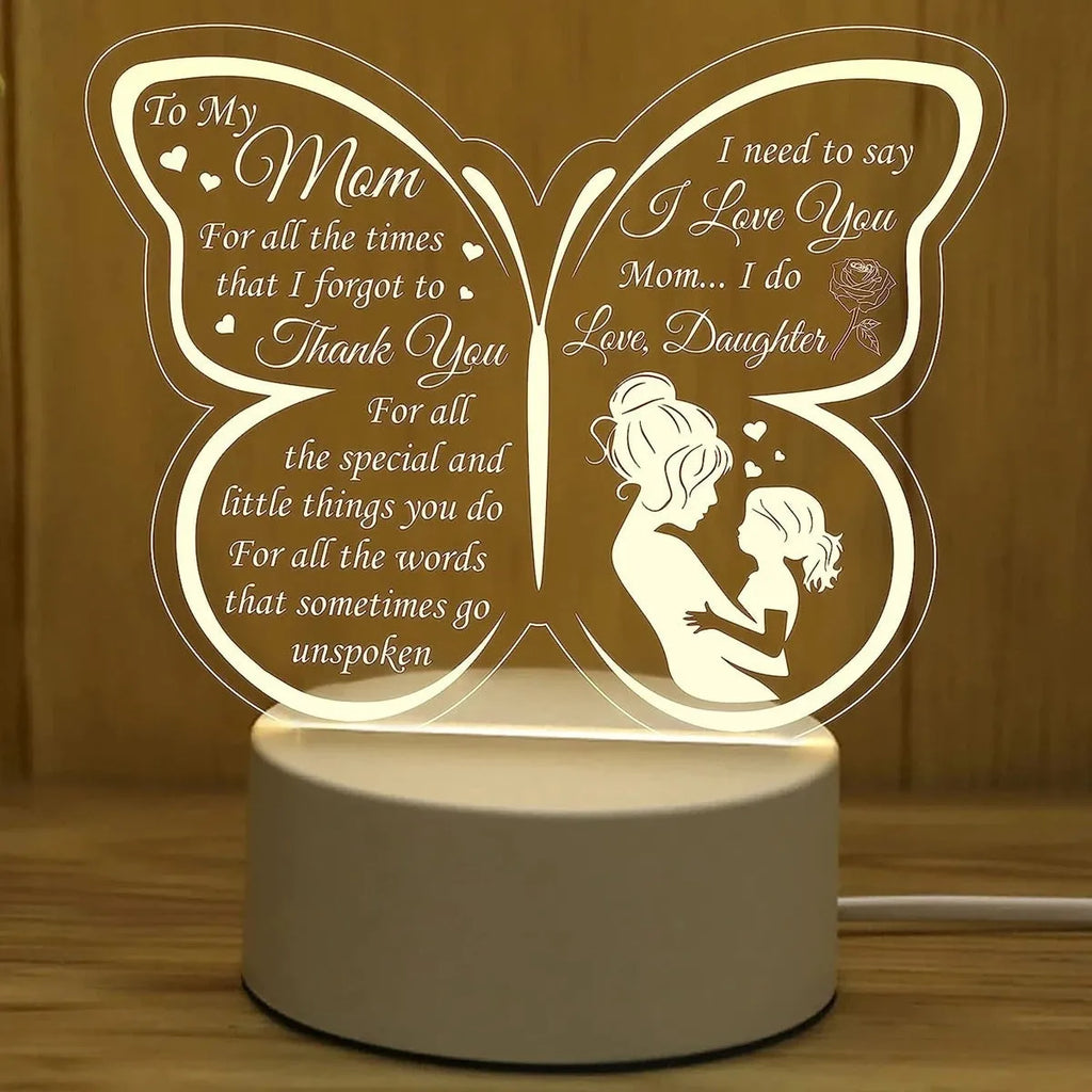 Heart-shaped table lamp with acrylic shade on a desk, glowing warm light, 160mm size, touch switch visible.