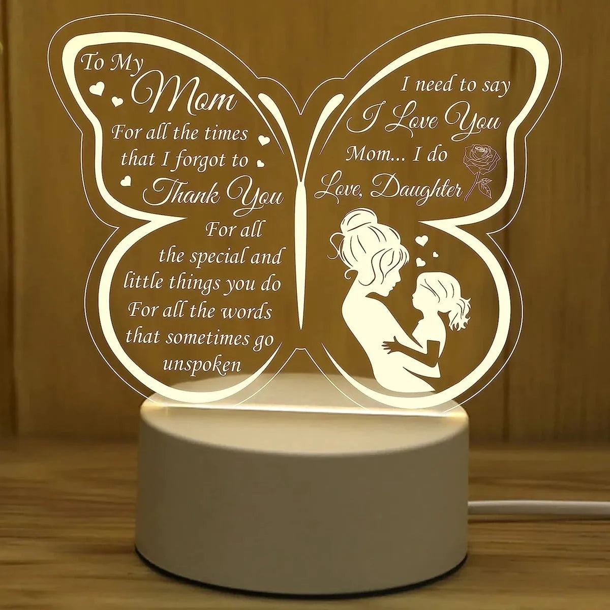 Heart-shaped table lamp with acrylic shade on a desk, glowing warm light, 160mm size, touch switch visible.