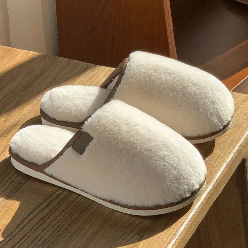 Unisex solid colour plush slippers with non-slip PVC soles and car stitching detail