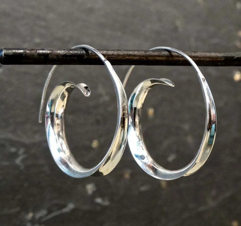 Round alloy ear studs with spiral leaf design in gold electroplated finish on white background