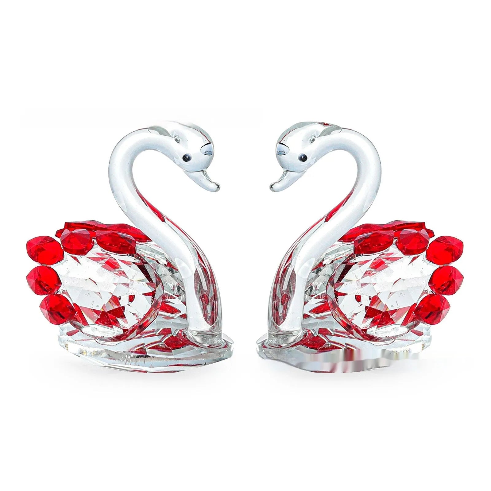 White crystal swan desktop ornament in red, blue, pink, or purple on a wood surface.