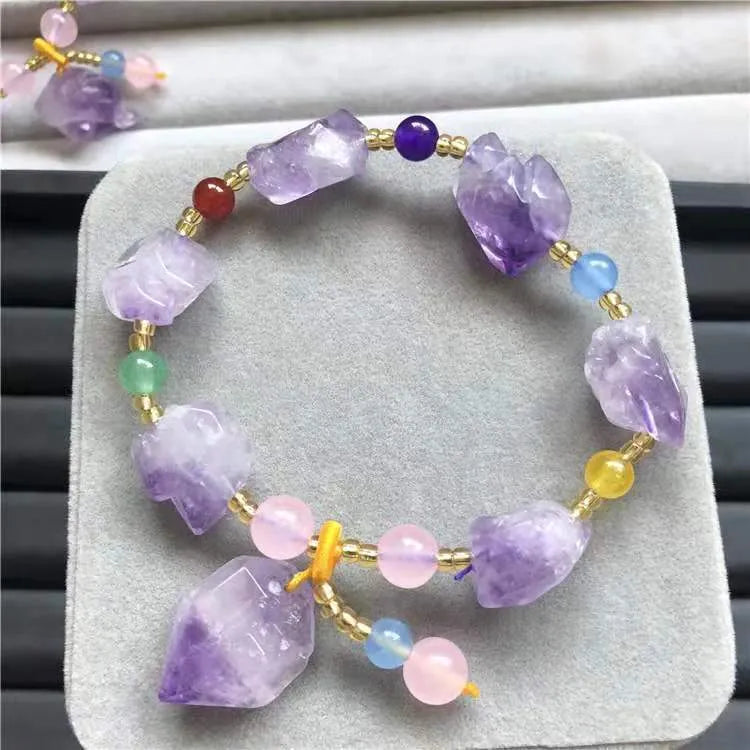 Natural shaped purple amethyst gemstone bracelet with a carved Fu character charm.