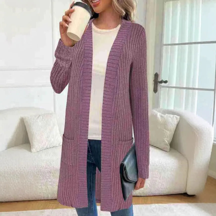 Long sleeve loose grey knitted cardigan jacket with pockets on a hanger