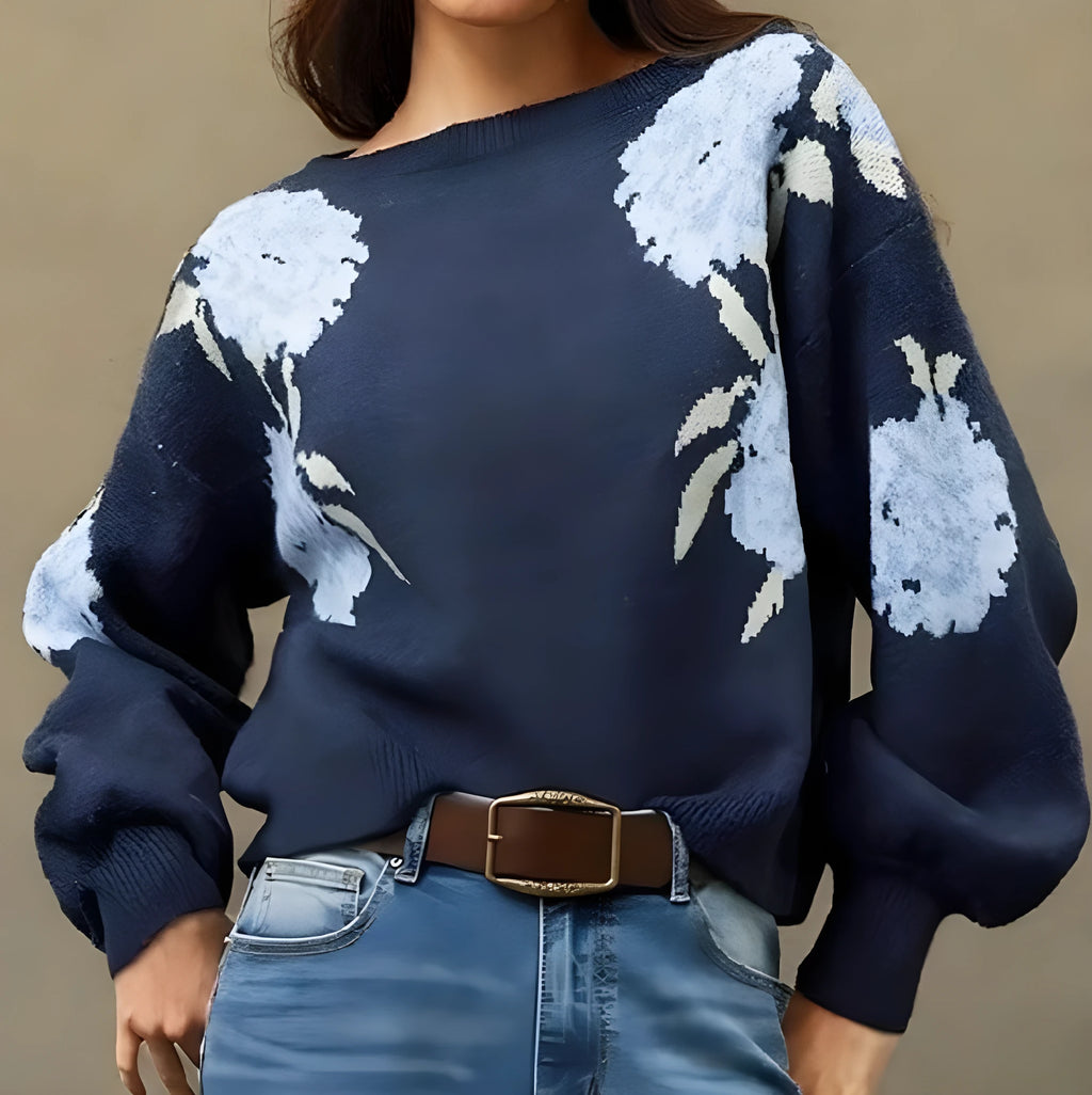 Women's loose-fit sapphire blue pullover with white flower jacquard pattern and long sleeves.