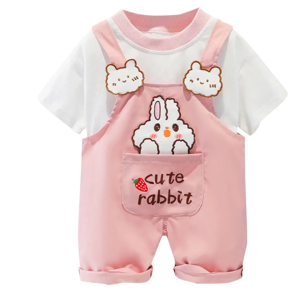Baby wearing yellow cotton summer overalls with cartoon design, short sleeves, and adjustable straps