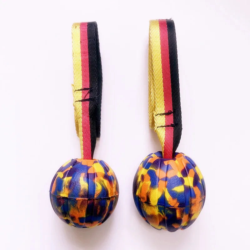 EVA floating tetherball dog toy in camouflage and yellow colours showing three diameter sizes