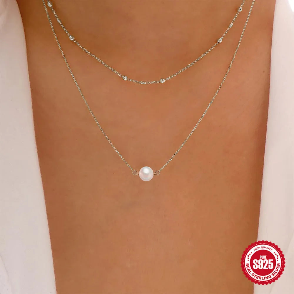 Sterling silver double layer pearl necklace with geometric pendant on ball bead chain
