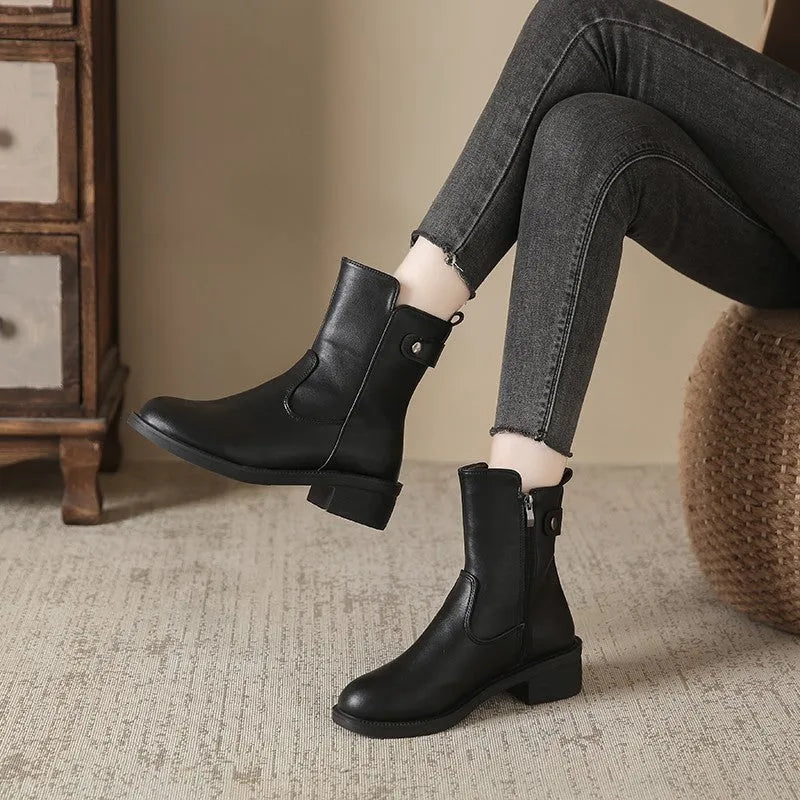 Black women's low heel ankle boots with side zip fastening and round toe design