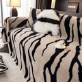Zebra pattern flannel sofa cover with non-slip backing in caramel colour