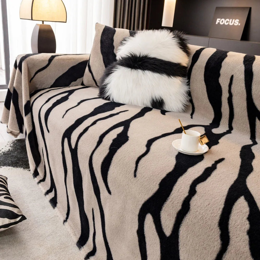 Zebra pattern flannel sofa cover with non-slip backing in caramel colour