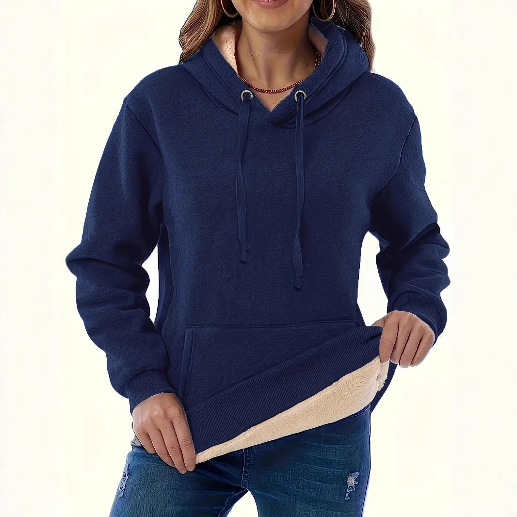 Women's loose-fit grey hooded sweater with a front pocket and a textured 3D pattern.