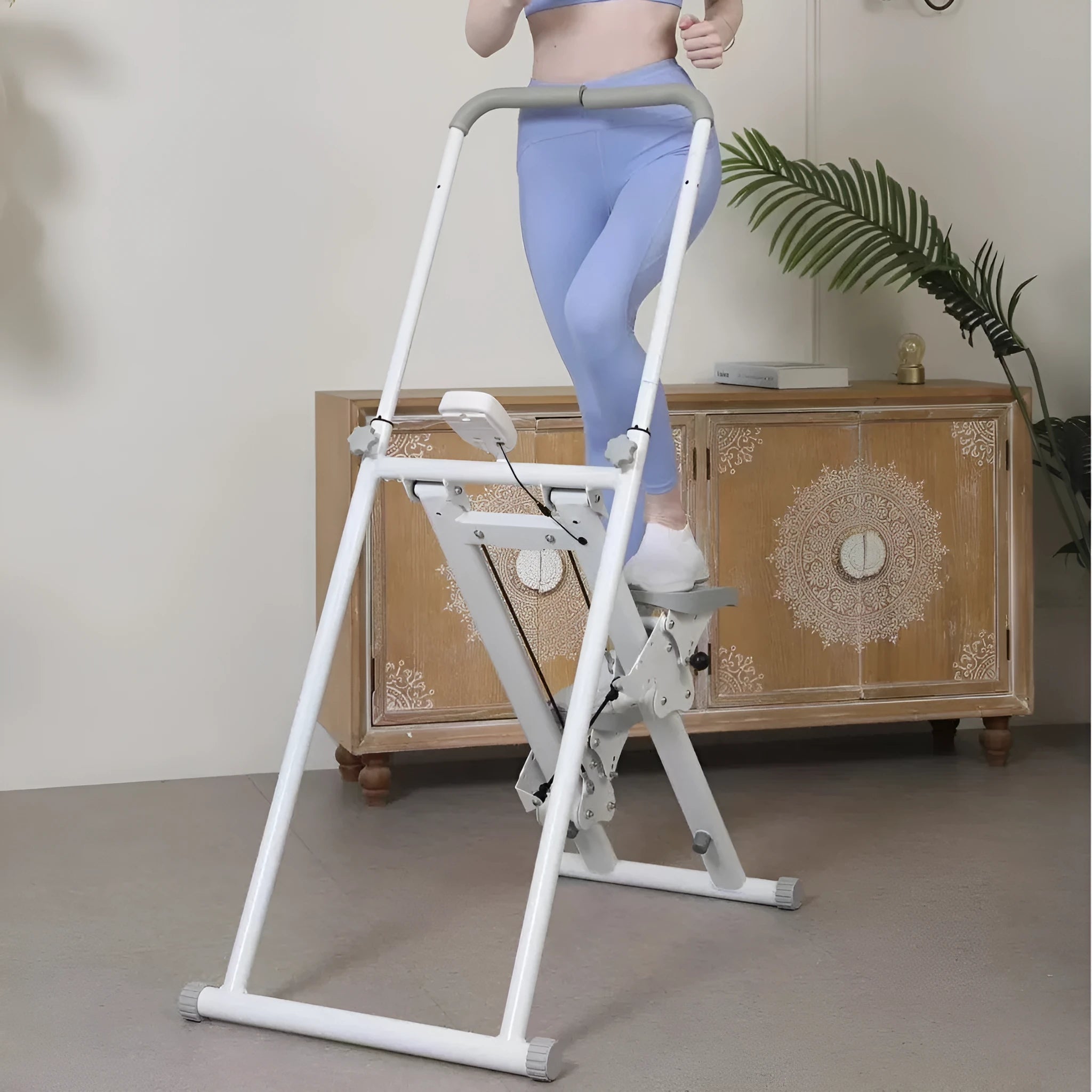 Foldable white treadmill with integrated climbing frame for home fitness workouts