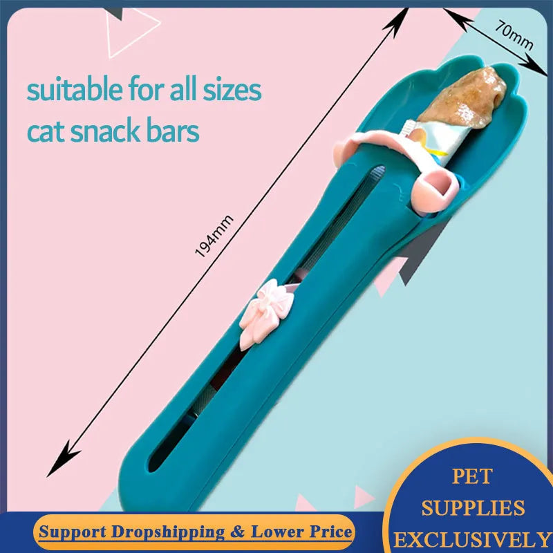 Plastic pet food squeezer dispenser in pink and green colours for feeding cats and puppies.