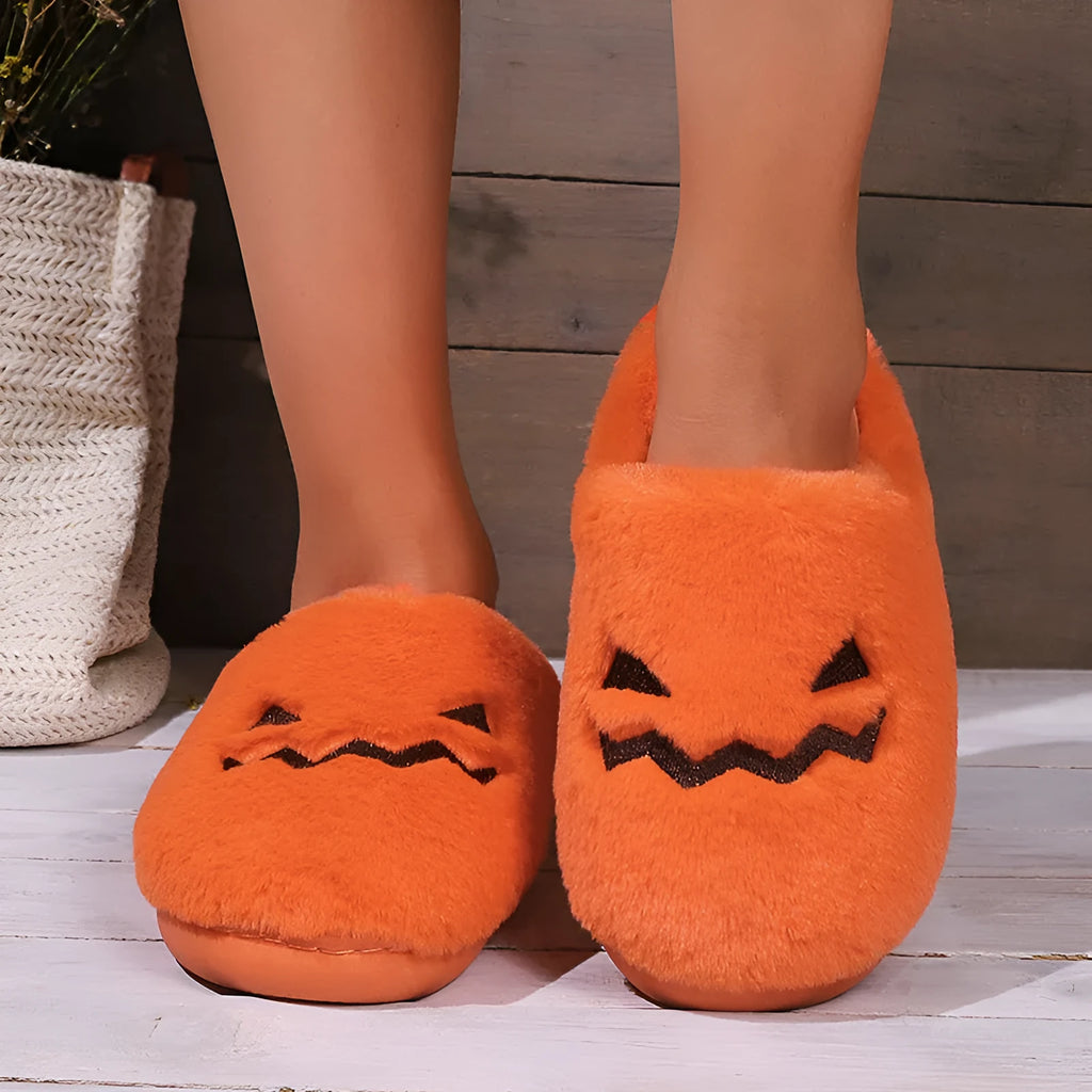 Orange Halloween pumpkin design plush slippers with coral velvet upper and flat PVC soles