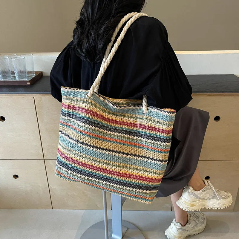 Blue straw woven nylon shoulder bag with single strap and polyester lining
