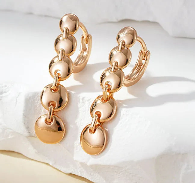 Retro long round circle earrings with woven copper construction and gold finish