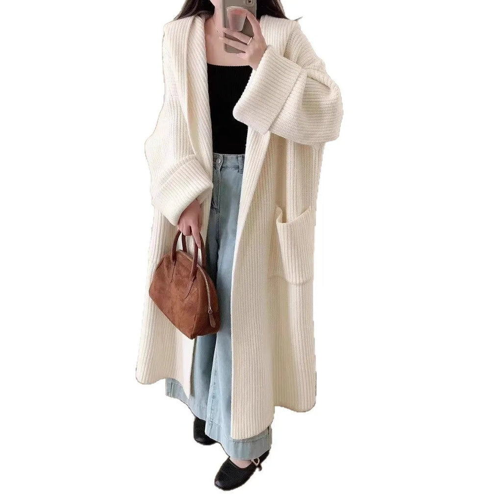 Women's loose hooded cardigan coat in acrylic fabric with raglan sleeves showing front opening
