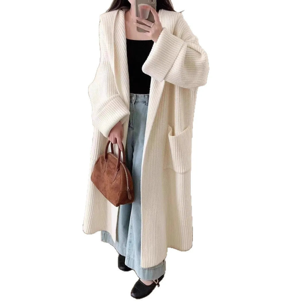 Women's loose hooded cardigan coat in acrylic fabric with raglan sleeves showing front opening