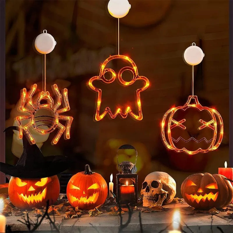 Halloween window hanging LED lights set with spider and pumpkin designs using suction cup installation