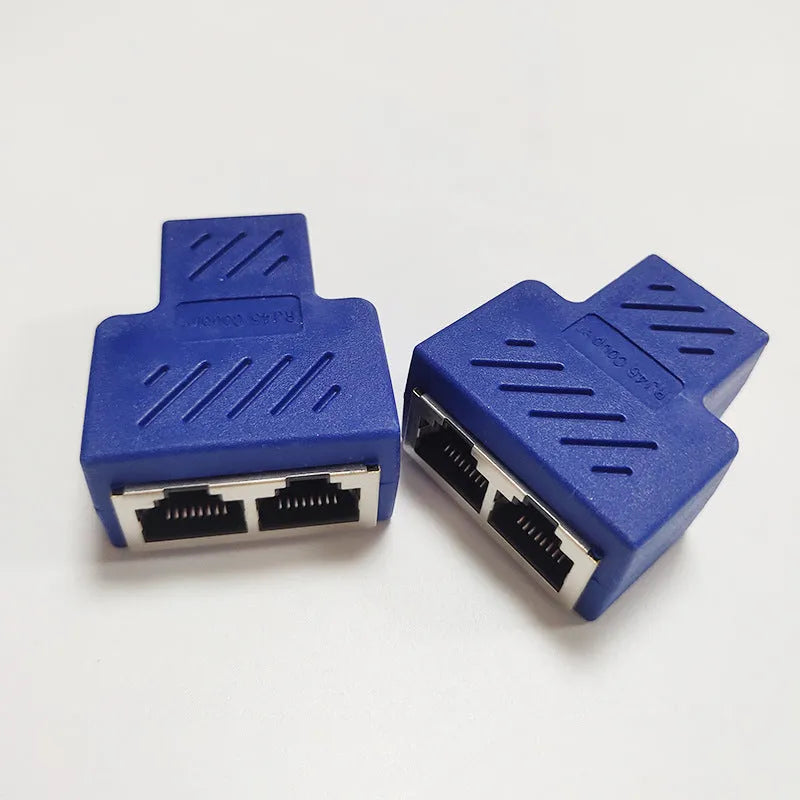 Two white RJ45 network cable splitter adapters showing one input and two output ports.