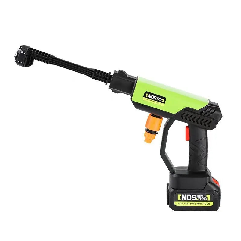 Green wireless high pressure water gun with multiple nozzle attachments on a table
