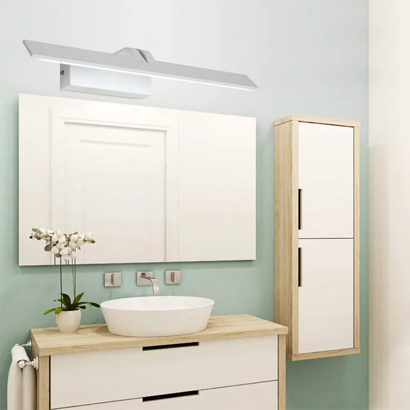 White framed LED bathroom mirror with integrated lighting, shown in a vanity setting.