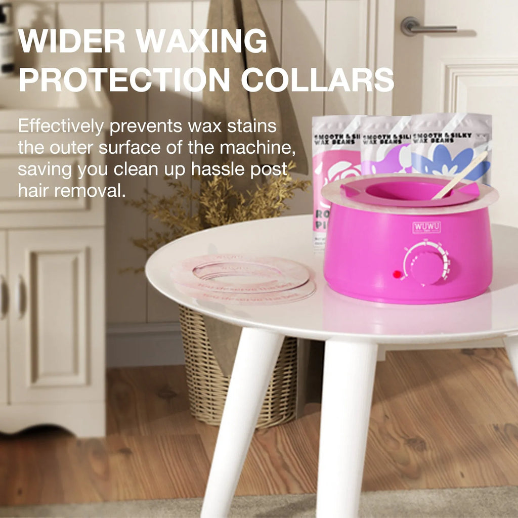 Professional waxing kit with hard wax beans, warmer, application sticks, post-care lotion and cooling masks on pink background