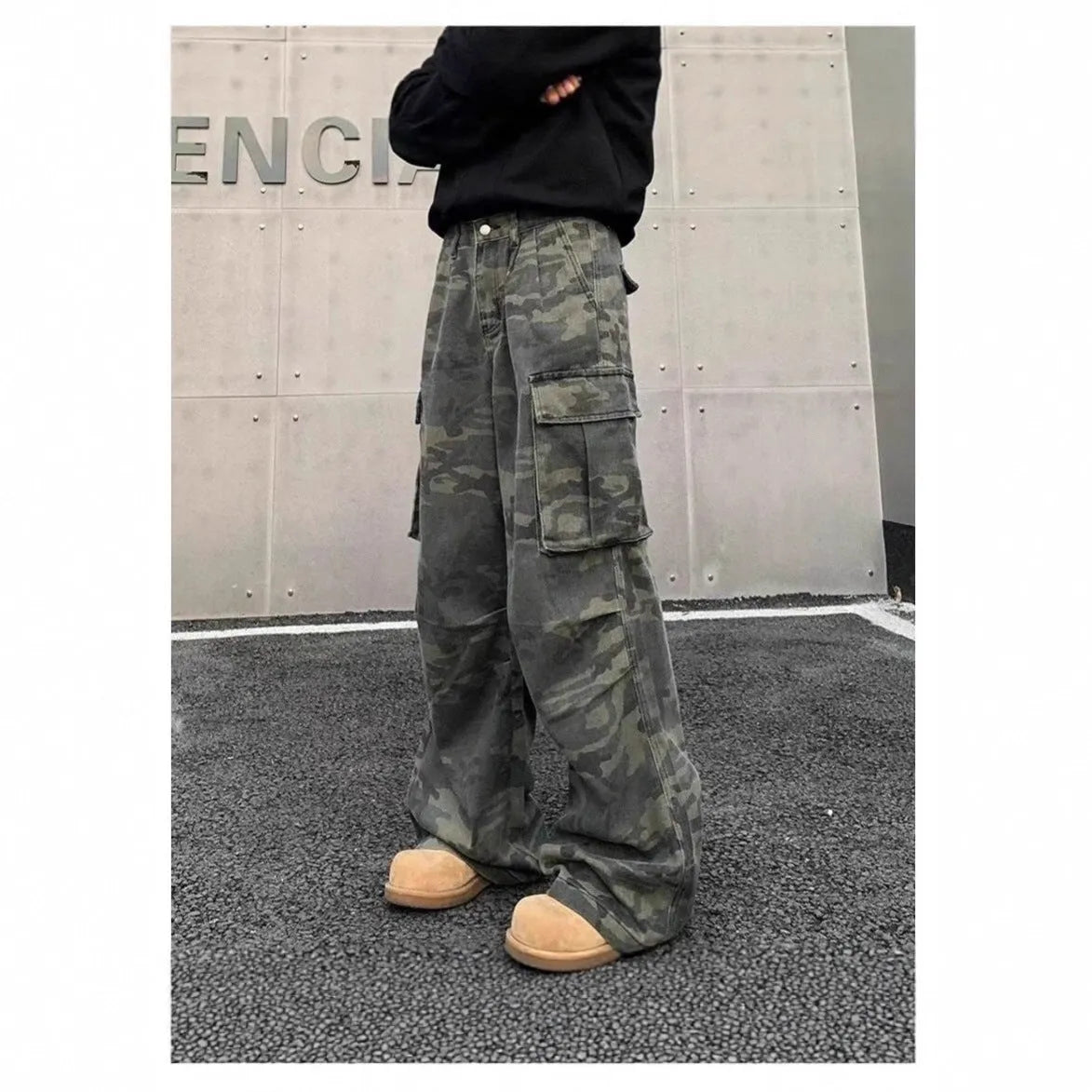Korean-style washed camouflage cargo pants with multiple pockets on a mid-waist fit.
