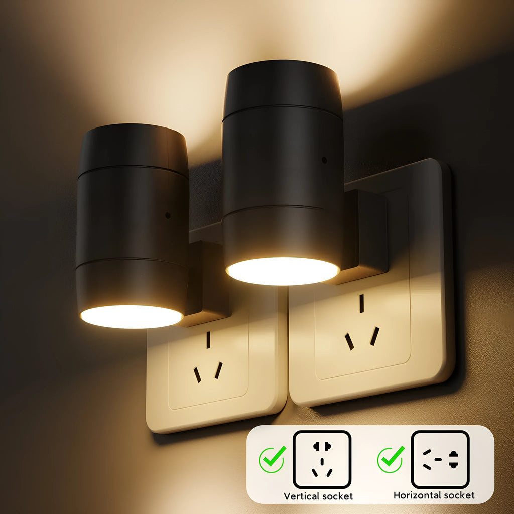 Small white plug-in night lamp with rotatable head showing adjustable brightness control, plugged into wall socket
