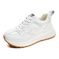 White women's cattlehide leather low-top casual sports shoes with a cross-strap and round toe.