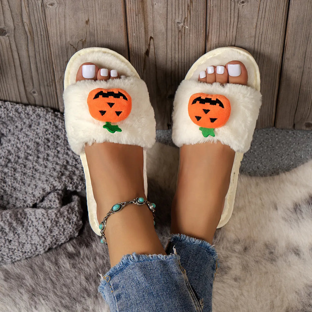 White and yellow pumpkin-themed plush open-toe slippers with a synthetic fur upper.