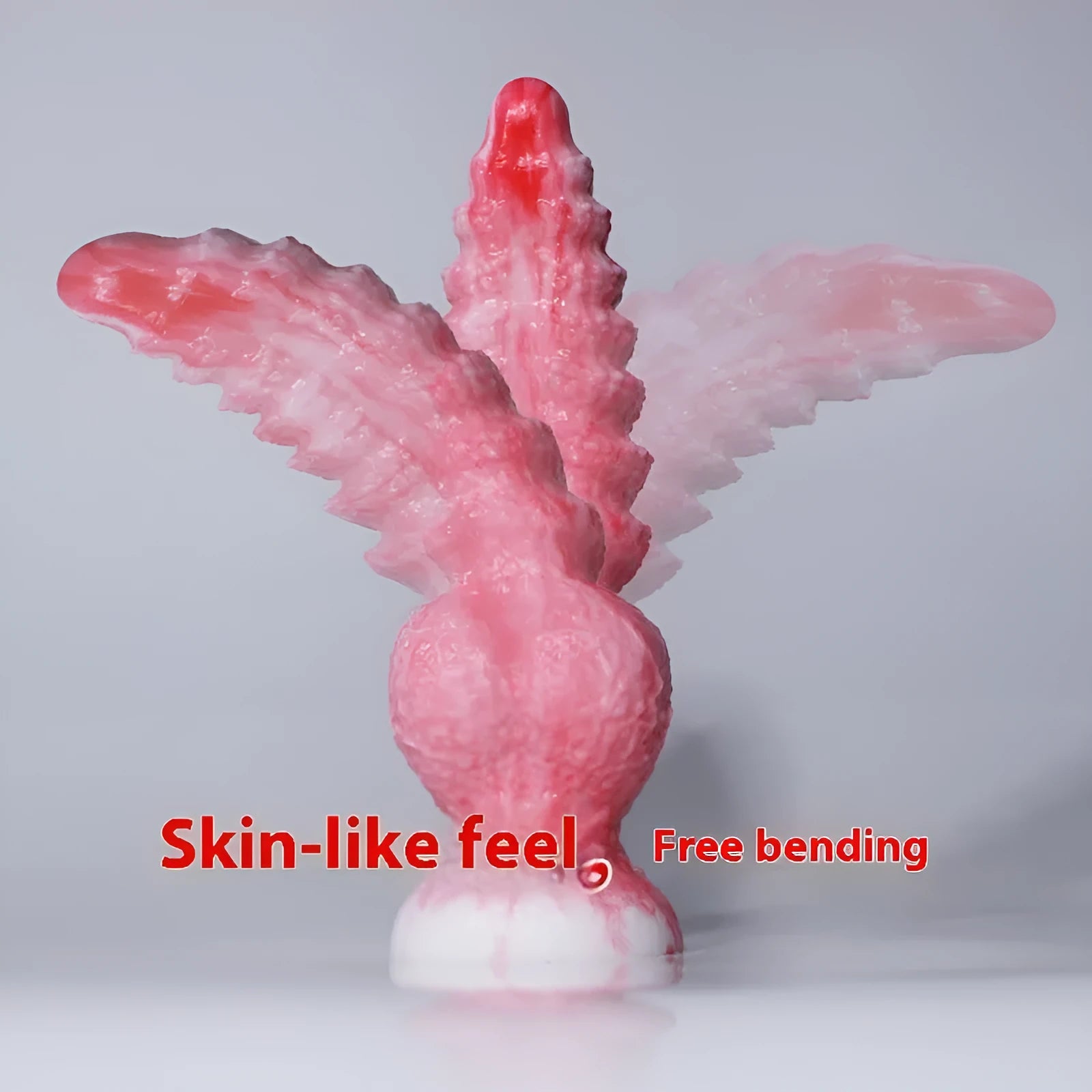 Pink platinum silicone penis-shaped women's masturbator sex toy on a plain background.