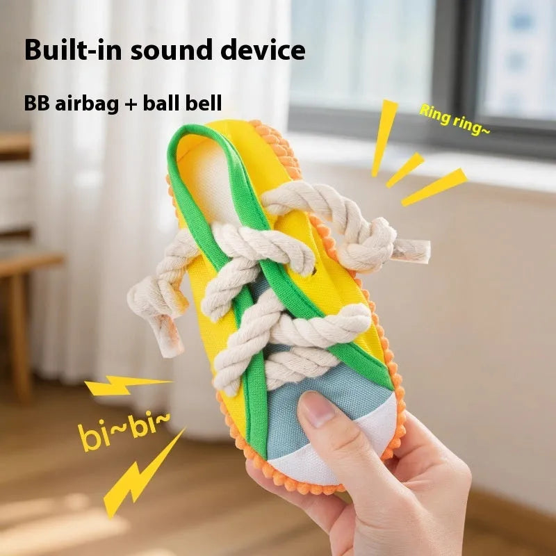 Plastic dog chew toy shaped like a slipper in yellow, black, and blue colour options.