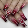 Wine red gradient fake nail tip with pearl heart accent and plaid pattern
