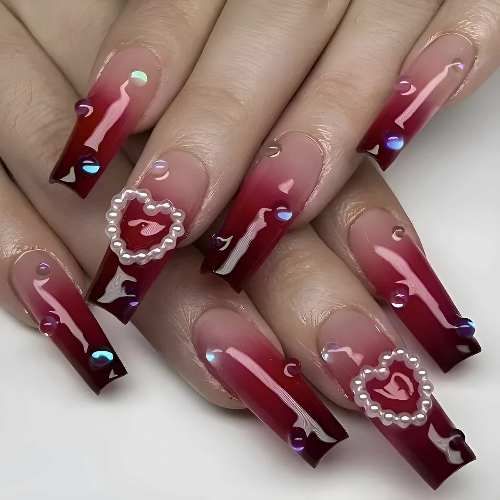 Wine red gradient fake nail tip with pearl heart accent and plaid pattern